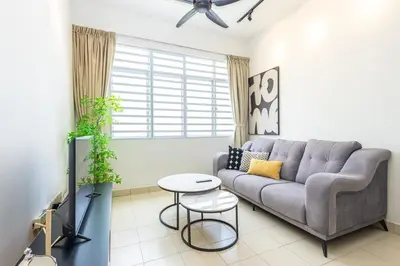 a living room with a couch and a table at O-Homestay at Falim 2 parking Mus lim friendly in Ipoh