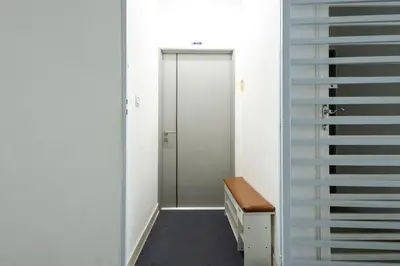 a walk in closet with a glass door and a staircase at O-Homestay at Falim 2 parking Mus lim friendly in Ipoh