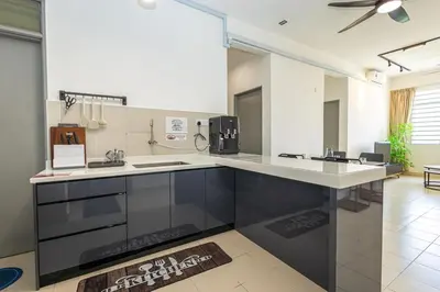 a large kitchen with a large white counter top at O-Homestay at Falim 2 parking Mus lim friendly in Ipoh