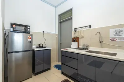 a kitchen with a refrigerator and a sink at O-Homestay at Falim 2 parking Mus lim friendly in Ipoh