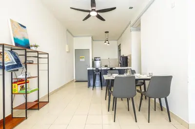 a dining room with a table and chairs and a ceiling fan at O-Homestay at Falim 2 parking Mus lim friendly in Ipoh