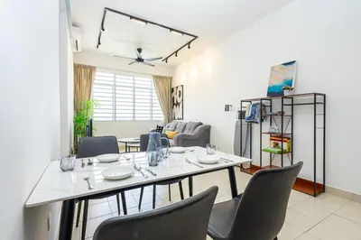 a dining room with a table and chairs at O-Homestay at Falim 2 parking Mus lim friendly in Ipoh