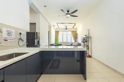 a kitchen with white counters and a ceiling fan at O-Homestay at Falim 2 parking Mus lim friendly in Ipoh