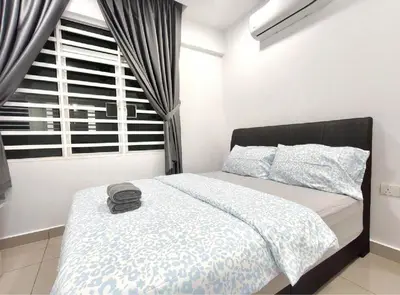 a bedroom with a large bed with a window at H2H - Welcome Home - Majestic Ipoh - 5pax in Ipoh
