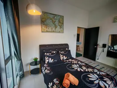 a bedroom with a bed with shoes on it at Studio BARRINGTON SQUARE II in Brinchang