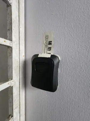 a tv on a wall with a money sticking out at Nina's Apt Parkview CH in Tanah Rata