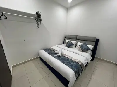 a bedroom with a bed in a room at Huwayna Private Pool Homestay M U S L I M sahaja in Kepala Batas