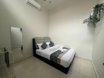 a small bedroom with a bed and a shower at Huwayna Private Pool Homestay M U S L I M sahaja in Kepala Batas