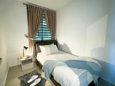a small bedroom with a bed and a window at IPOH The Majestic Ipoh Town View Fully Air-Con Home in Ipoh
