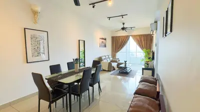 a dining room and living room with a table and chairs at IPOH The Majestic Ipoh Town View Fully Air-Con Home in Ipoh