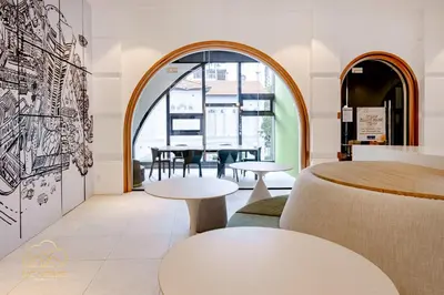 a restaurant with two tables and a dining room at 22Macalisterz by MC Home in George Town