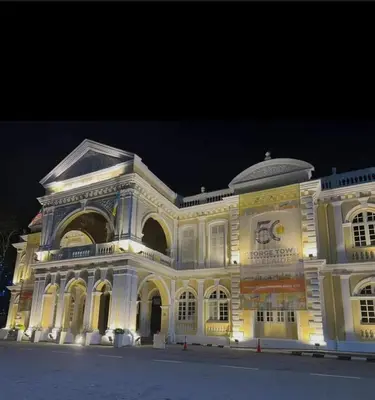 a large building is lit up at night at GURNEY DRIVE Family-friendly Cozy Retreat 2-6 pax in George Town