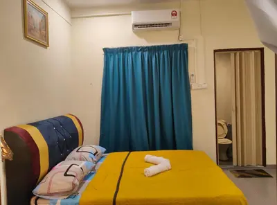 a hospital room with a bed and a blue curtain at GURNEY DRIVE Family-friendly Cozy Retreat 2-6 pax in George Town