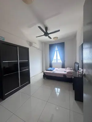 a bedroom with a bed and a ceiling fan at BG Roomstay in Ipoh