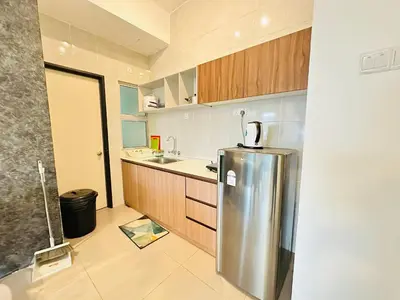 a kitchen with a stainless steel refrigerator at Homestay Golden Hills in Brinchang