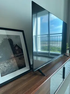 a room with a window and a picture on a ledge at Metropol by BRB in Bukit Mertajam
