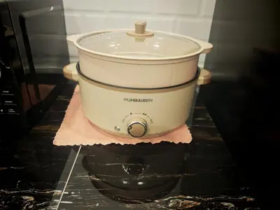 a slow cooker sitting on top of a counter at The Crayon Shin-chan Themed Stay Family Ipoh By LUX SUITE in Ipoh