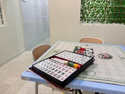 a table with a tray on top of it at The Crayon Shin-chan Themed Stay Family Ipoh By LUX SUITE in Ipoh