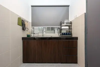 a kitchen with a sink and a mirror at Emerald Avenue Brinchang Near Centrum- Cozy Family Stay Clover Home 5-06 in Brinchang