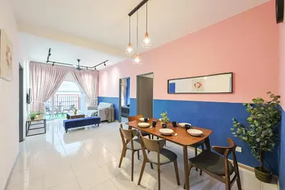a dining room and living room with a table and chairs at Emerald Avenue Brinchang Near Centrum- Cozy Family Stay Clover Home 5-06 in Brinchang