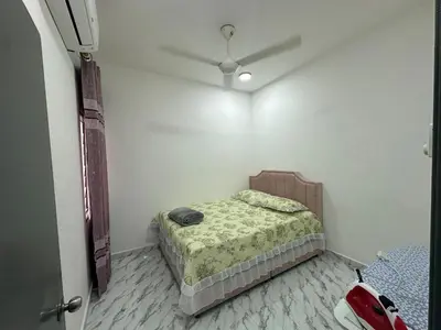 a bedroom with a bed and a red car in it at RJ Homestay Bandar Utama Gua Musang in Gua Musang