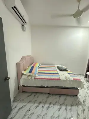 a bed in a white room with a bed in a bedroom at RJ Homestay Bandar Utama Gua Musang in Gua Musang