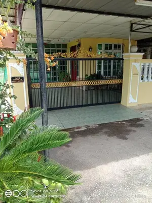 a front porch of a house with a fence at Homestay Bedong Teratak Kasih in Gua Sai