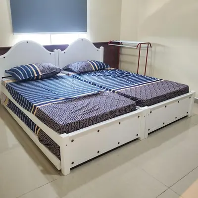 a bed with two pillows on it in a room at Nilai Mesahill Premier Deluxe Luxury Homestay,Mesamall in Gua Sai