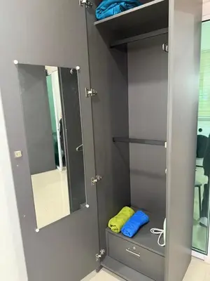 a bathroom with a mirror and some blue towels at Nilai Mesahill Premier Deluxe Luxury Homestay,Mesamall in Gua Sai