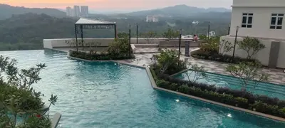 a swimming pool on top of a building at Nilai Mesahill Premier Deluxe Luxury Homestay,Mesamall in Gua Sai