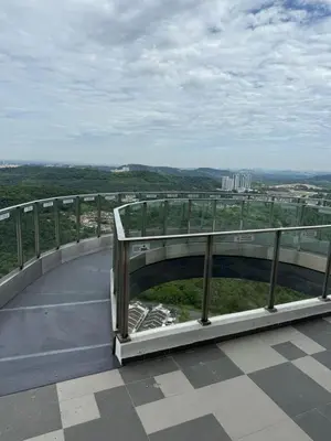 a bridge over a road with a view of a city at Nilai Mesahill Premier Deluxe Luxury Homestay,Mesamall in Gua Sai