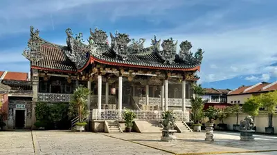 a building with a pagoda in a city at Soori Penang in George Town