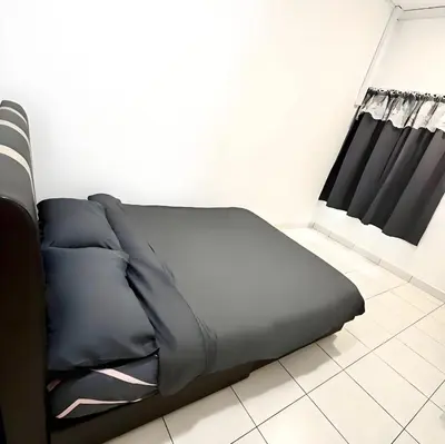 a bed in a room with black curtains at J Cozy Stay - 3B 2B, Fair Park Ipoh in Ipoh