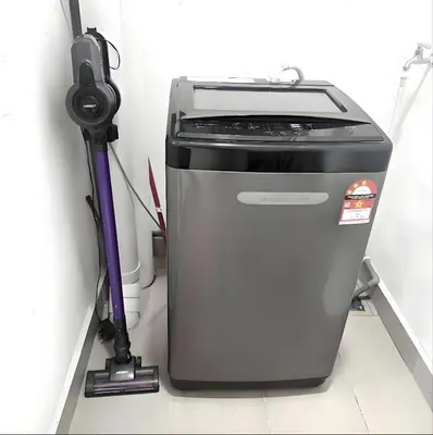 a printer sitting on a floor with a vacuum at J Cozy Stay - 3B 2B, Fair Park Ipoh in Ipoh
