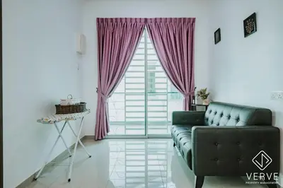 a living room with a couch and a large window at Ipoh Gateway by Verve 4R4B - 14 Pax in Ipoh