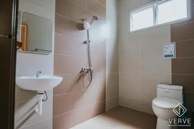 a bathroom with a toilet and a sink at Ipoh Gateway by Verve 4R4B - 14 Pax in Ipoh