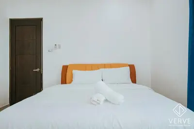 a bed with two towels sitting on top of it at Ipoh Gateway by Verve 4R4B - 14 Pax in Ipoh