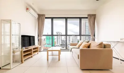 a living room with a couch and a large window at Urban Suites Jelutong Georgetown Penang 6pax 3BR Family Cozy Homestay in George Town