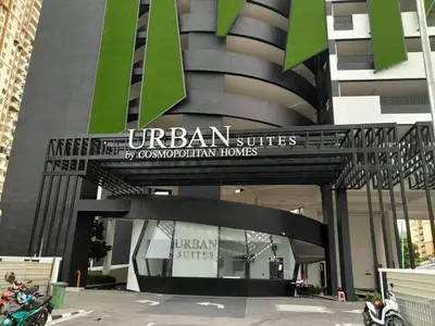 a building with a sign that reads urban sites by condominium homes at Urban Suites Jelutong Georgetown Penang 6pax 3BR Family Cozy Homestay in George Town