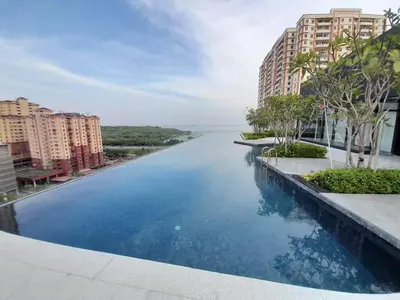 a large swimming pool with a view of a river at Urban Suites Jelutong Georgetown Penang 6pax 3BR Family Cozy Homestay in George Town