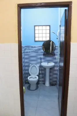 a bathroom with a toilet and a sink at Shaja Homestay in Kampong Kepayang