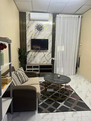 a living room with a couch and a table at laman terrace in Sungai Petani