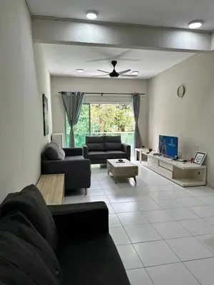 a living room with a couch and a table at Ayaan Quintet Evergreen with FIFA & Private Parking in Tanah Rata