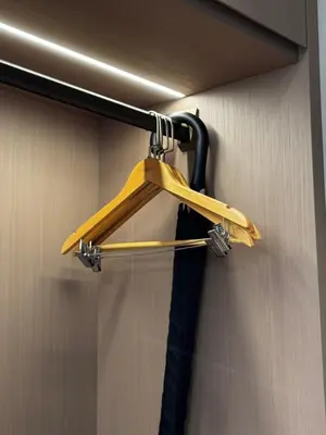 a wooden hanger on the wall of a bathroom at Tambuna Retreat ,TAMBUN ,IPOH in Tambun