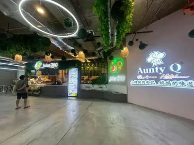 a man standing in front of an empty restaurant at Modern Cozy Seaview Entire Suites 118 Island Plaza in George Town