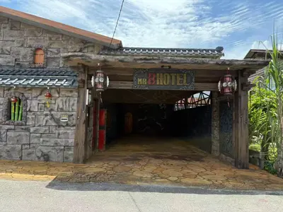 a building with a sign that reads the hotel at MR B hotel in Bukit Mertajam