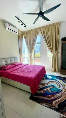 a bedroom with a bed and a ceiling fan at RR Casa Space Homestay Ipoh in Ipoh