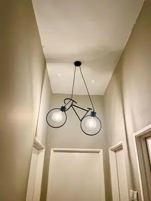 a pair of lights hanging from a ceiling at RR Casa Space Homestay Ipoh in Ipoh