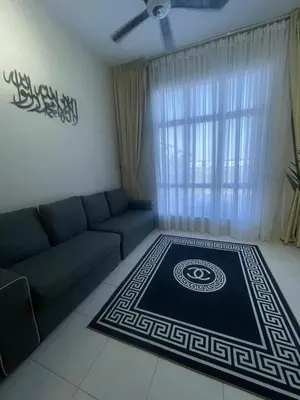 a living room with a couch and a rug at RR Casa Space Homestay Ipoh in Ipoh