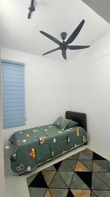 a bedroom with a bed and a ceiling fan at RR Casa Space Homestay Ipoh in Ipoh